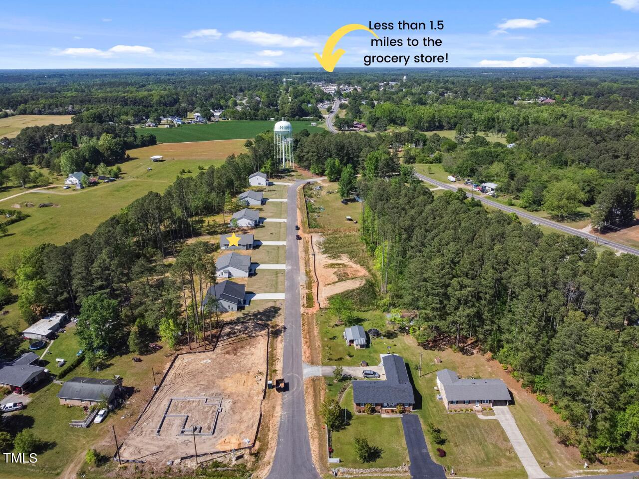 93 Regis Lane Coats, NC 27521 - Photo 4 of 31 an aerial view of residential building with outdoor space and lake view