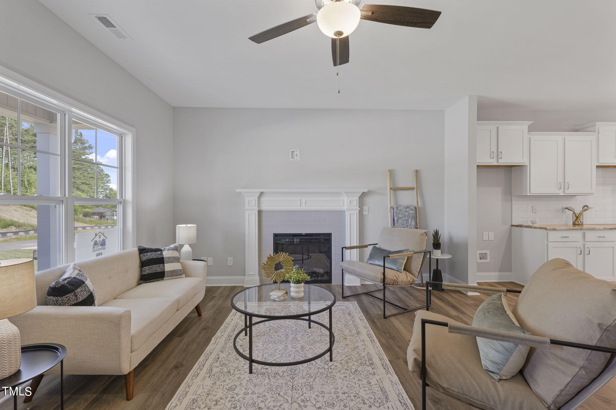 93 Regis Lane Coats, NC 27521 - Photo 7 of 31 a living room with furniture a fireplace and a large window
