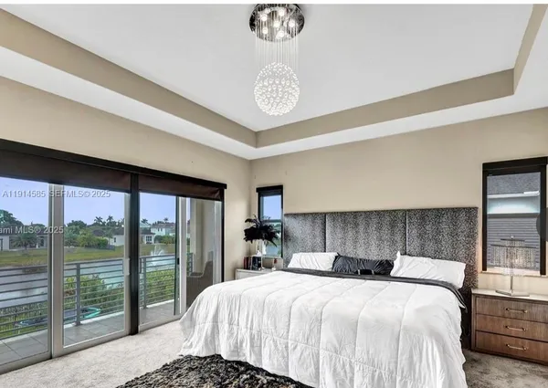 a bedroom with a large bed and a table