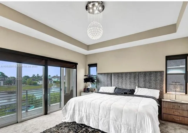 a bedroom with a large bed and a table