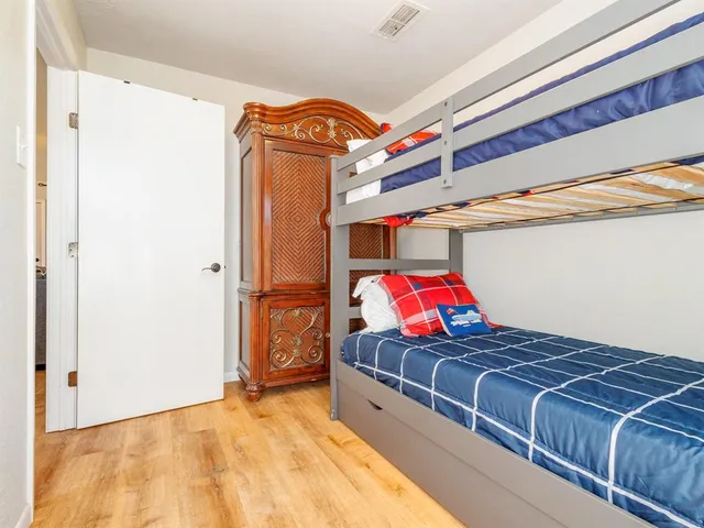 a view of a bed in a room