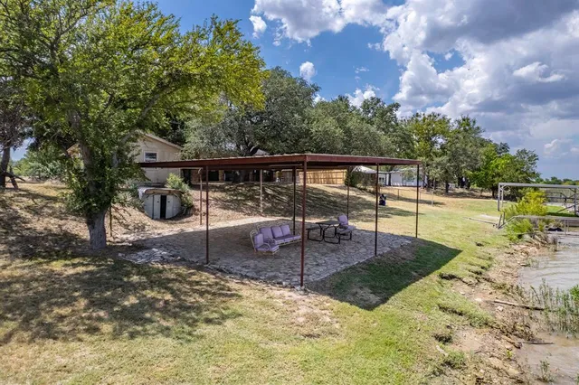a view of a swimming pool with a patio