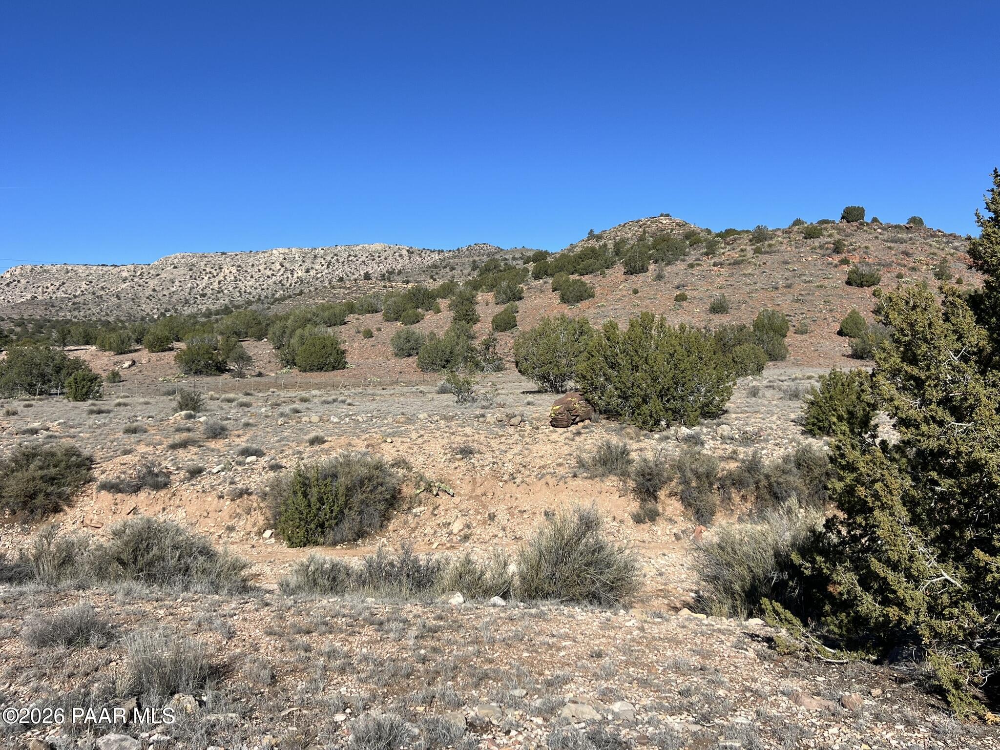 298 Quartz Hill Road Ash Fork, AZ 86320 - Photo 10 of 15 a view of a beach with mountains in the background