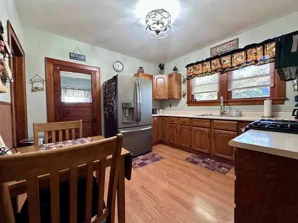 a kitchen with a sink stove and cabinets