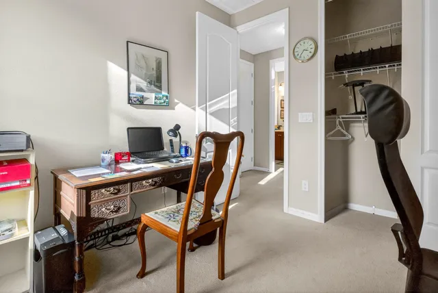 a view of a workspace with furniture