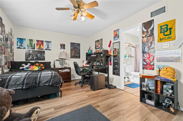 a bedroom with furniture and a bed