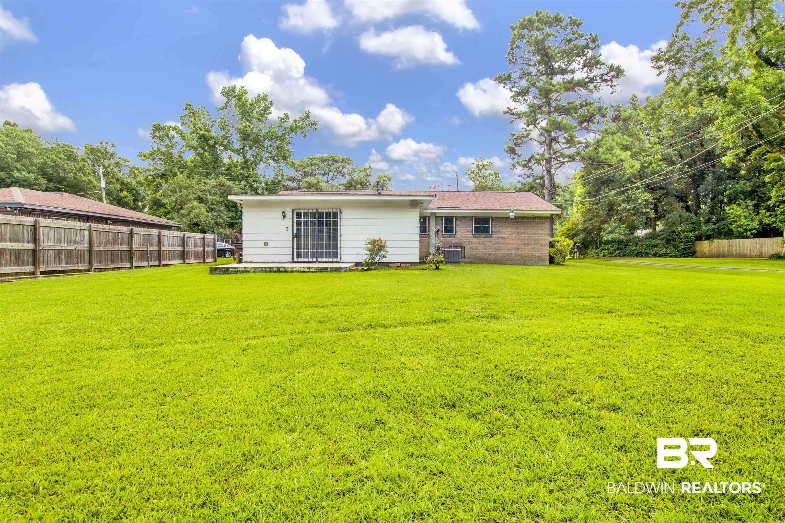 1476 Boudousquie Street Mobile, AL 36605 - Photo 33 of 34 Rear view of house with brick siding