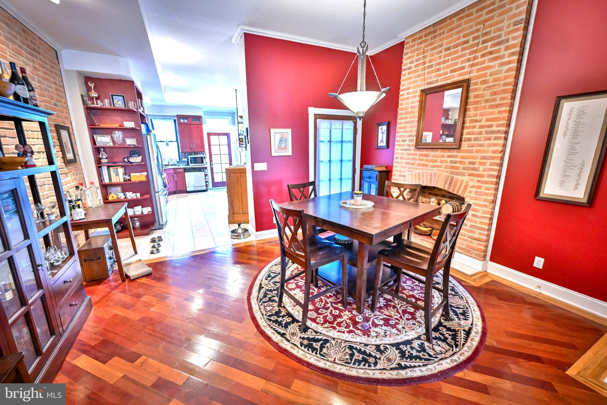 240 Wilson Street Baltimore, MD 21217 - Photo 15 of 63 a dining room with furniture and wooden floor