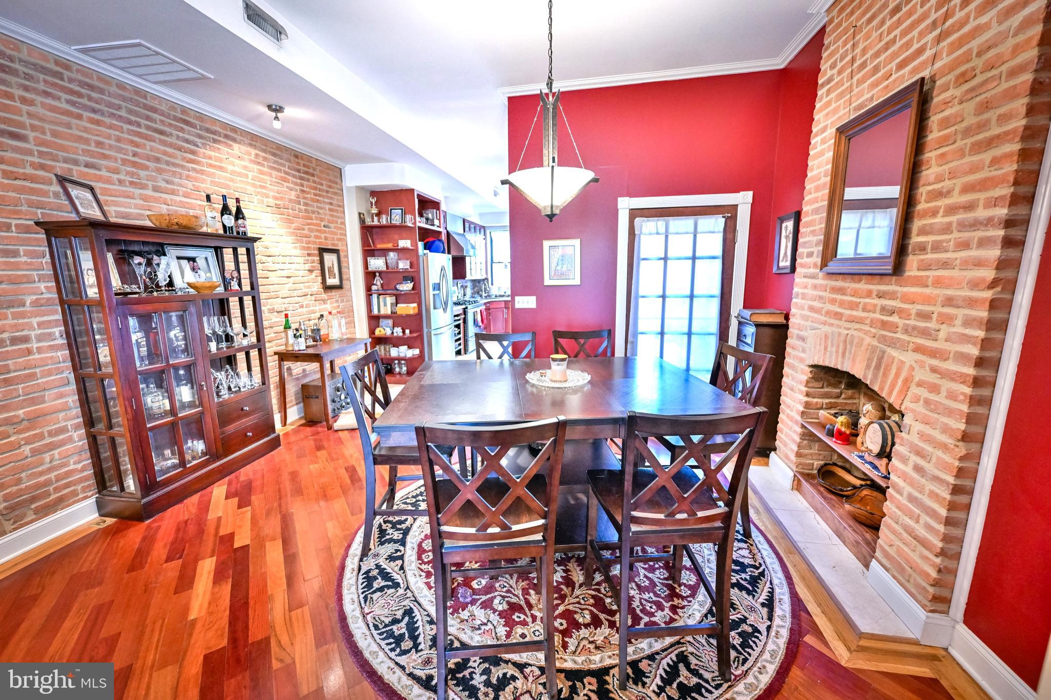 240 Wilson Street Baltimore, MD 21217 - Photo 16 of 63 a dining room with furniture and wooden floor