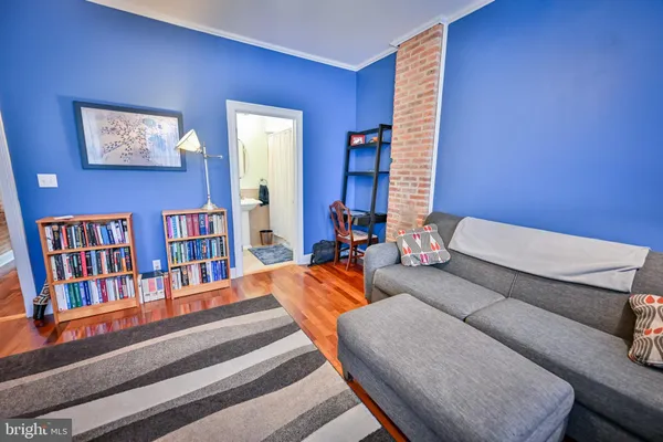 a living room with furniture or couch and a window