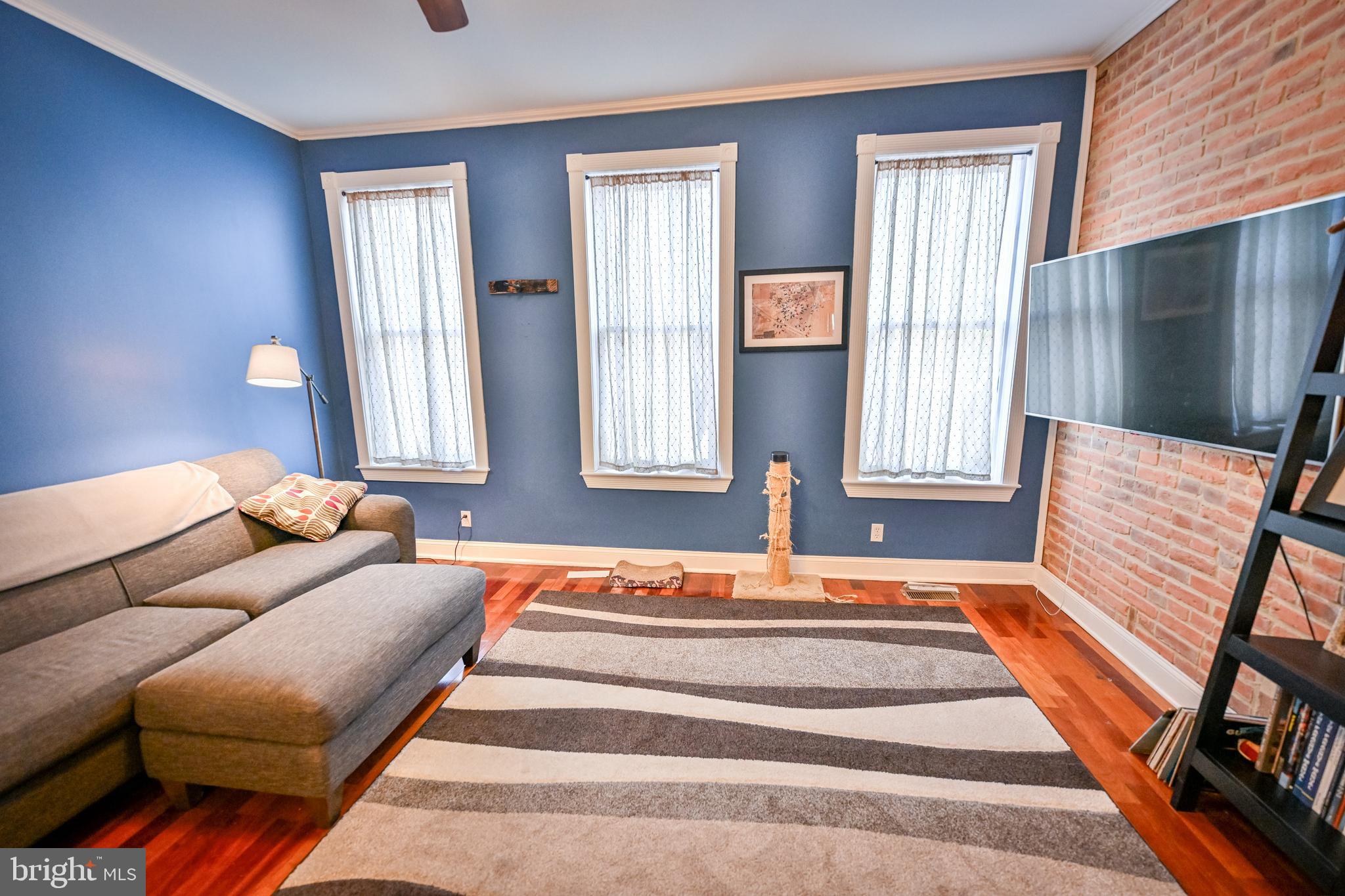 240 Wilson Street Baltimore, MD 21217 - Photo 29 of 63 a bedroom with furniture and a window