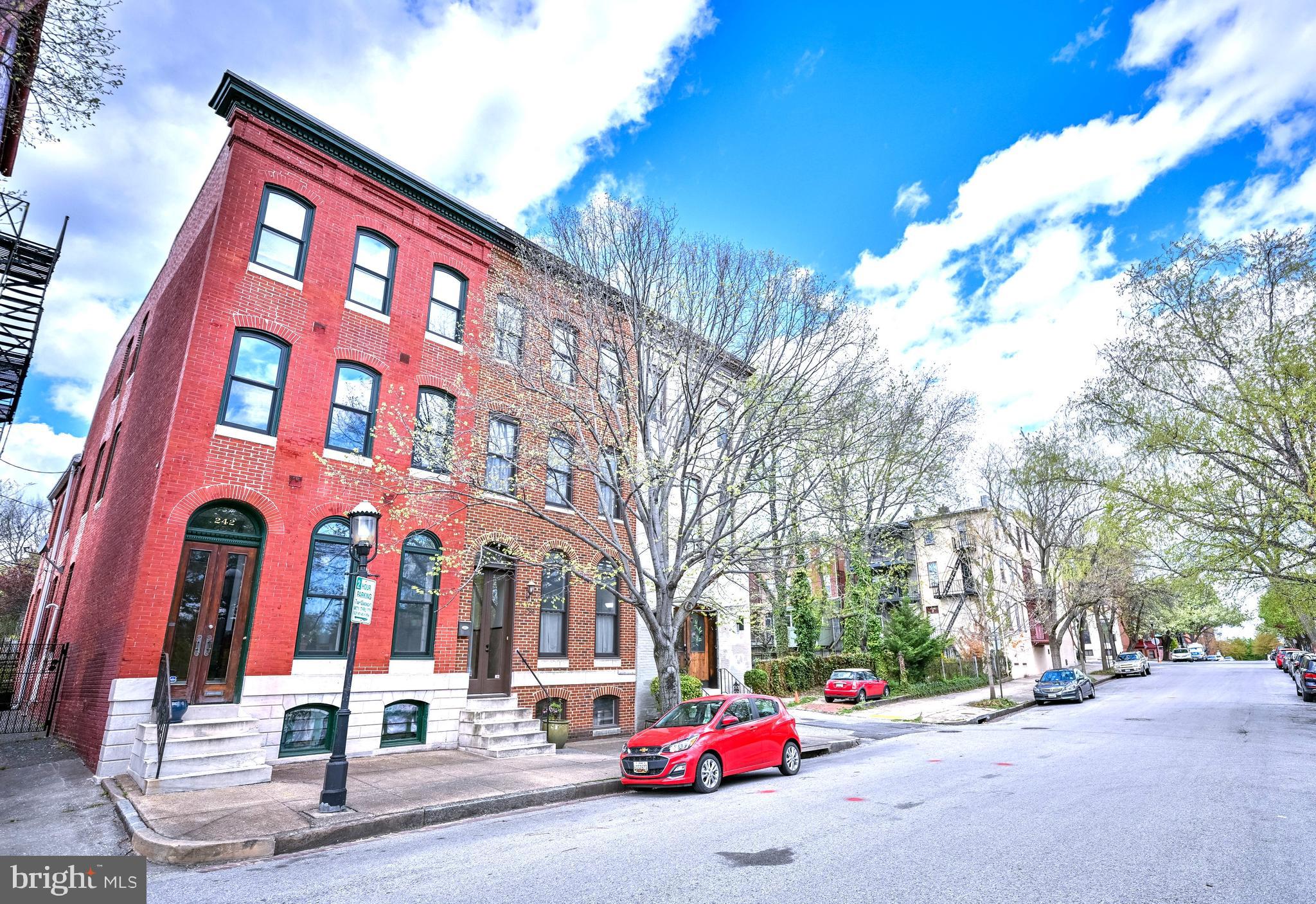 240 Wilson Street Baltimore, MD 21217 - Photo 3 of 63 Brick Front Rowhome on tree-lined street