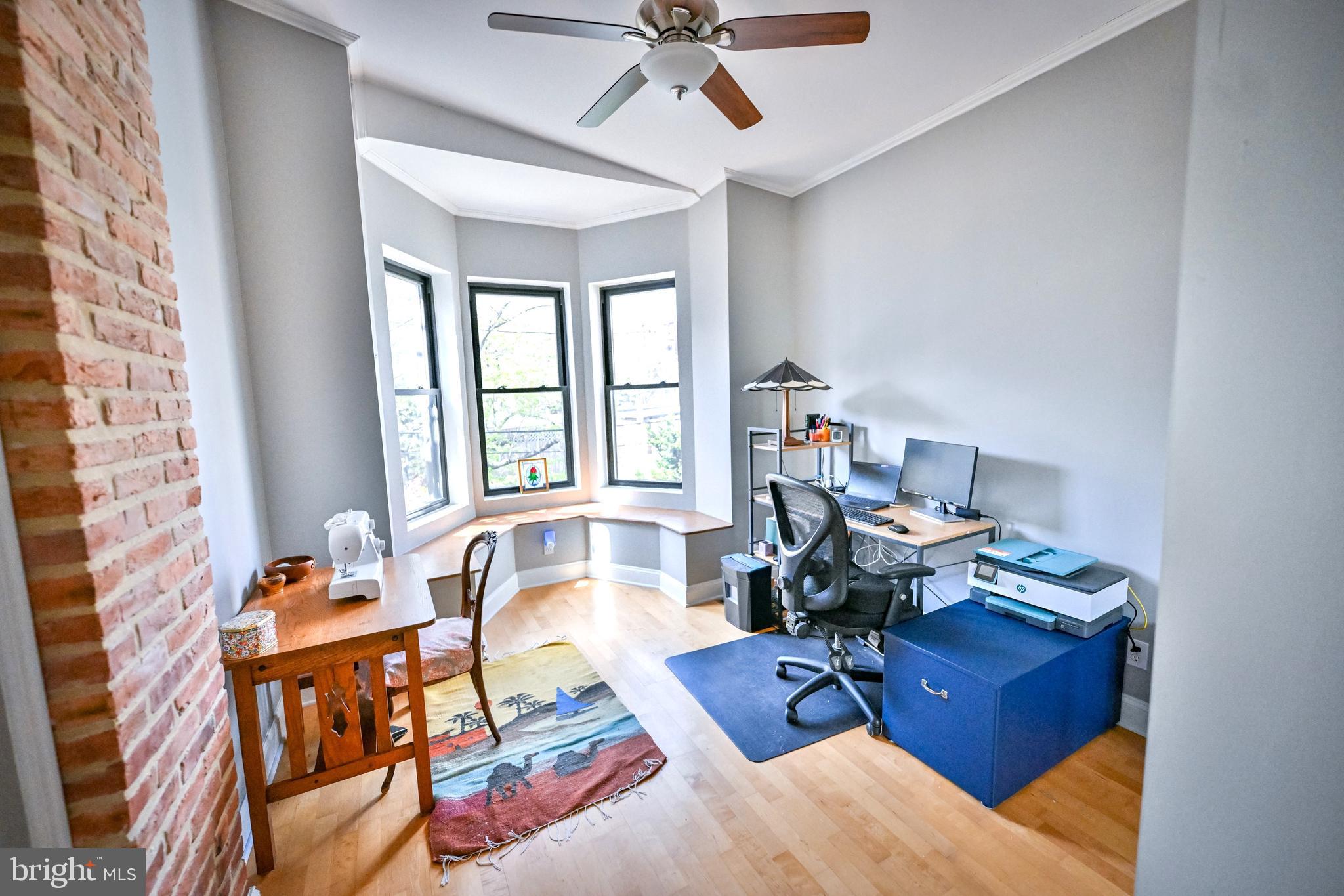 240 Wilson Street Baltimore, MD 21217 - Photo 38 of 63 a living room with furniture or couch and a window