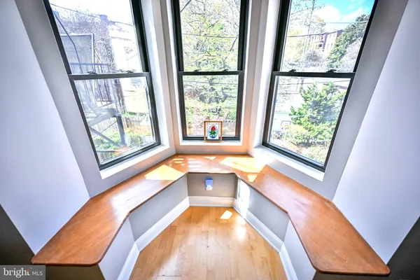 a bath tub sitting next to a window