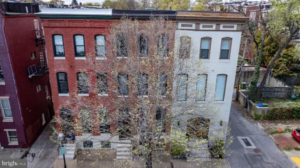 an aerial view of houses with outdoor space
