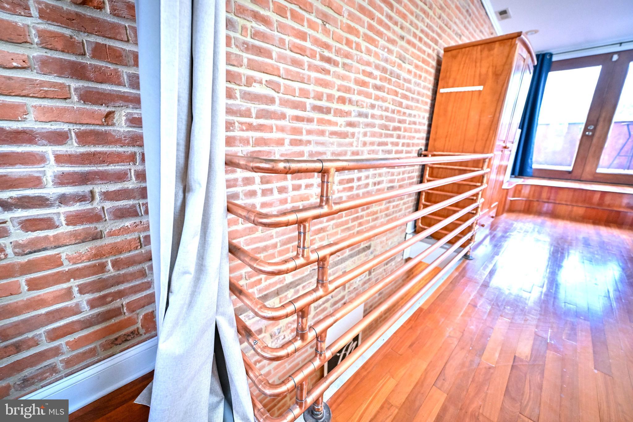 240 Wilson Street Baltimore, MD 21217 - Photo 41 of 63 a view of a balcony with wooden floor and a sink