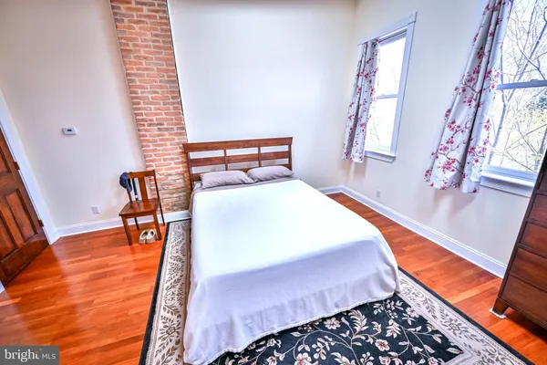 a white toilet sitting next to a shower curtain