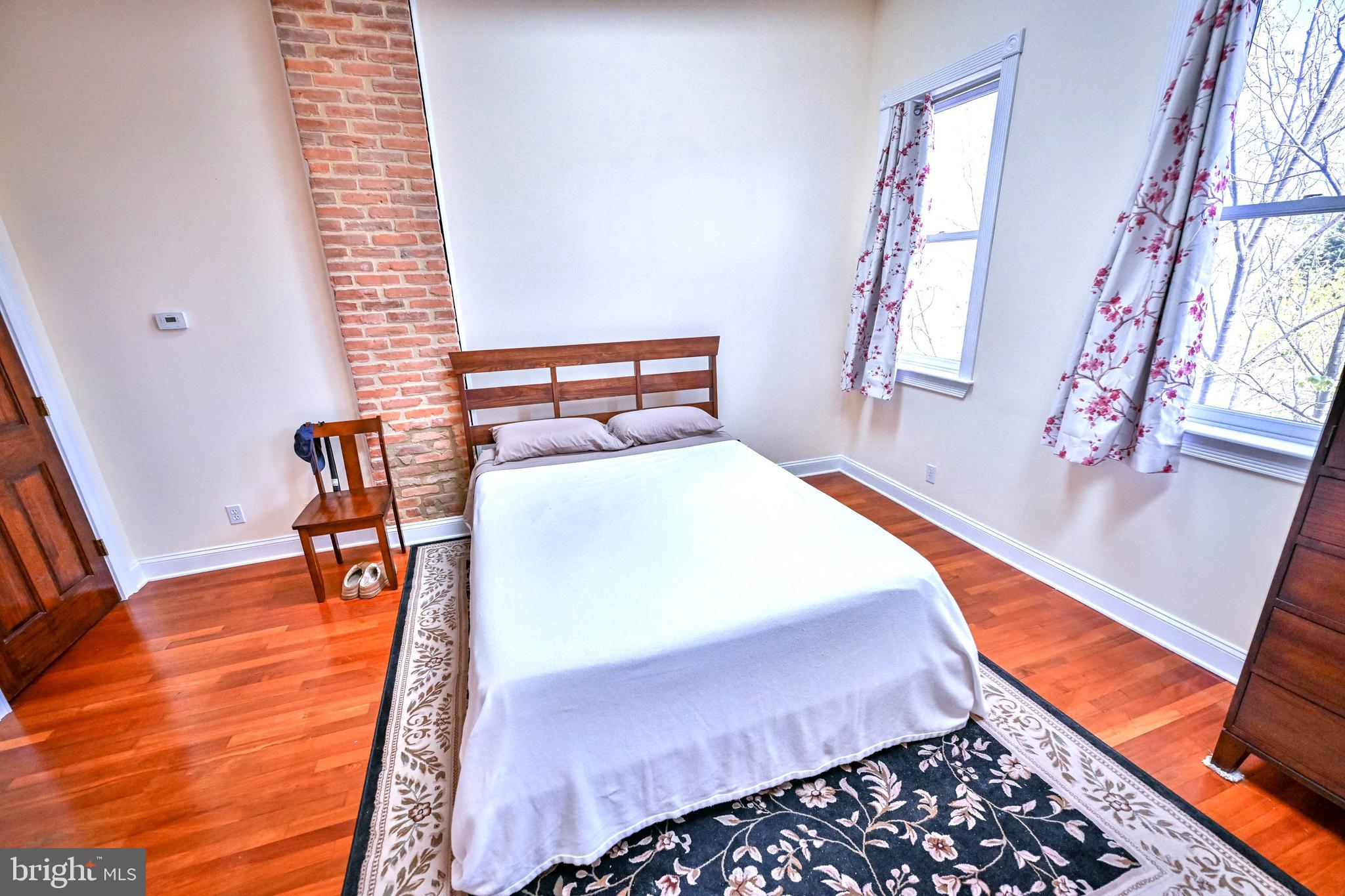 240 Wilson Street Baltimore, MD 21217 - Photo 46 of 63 a bedroom with bed and a window