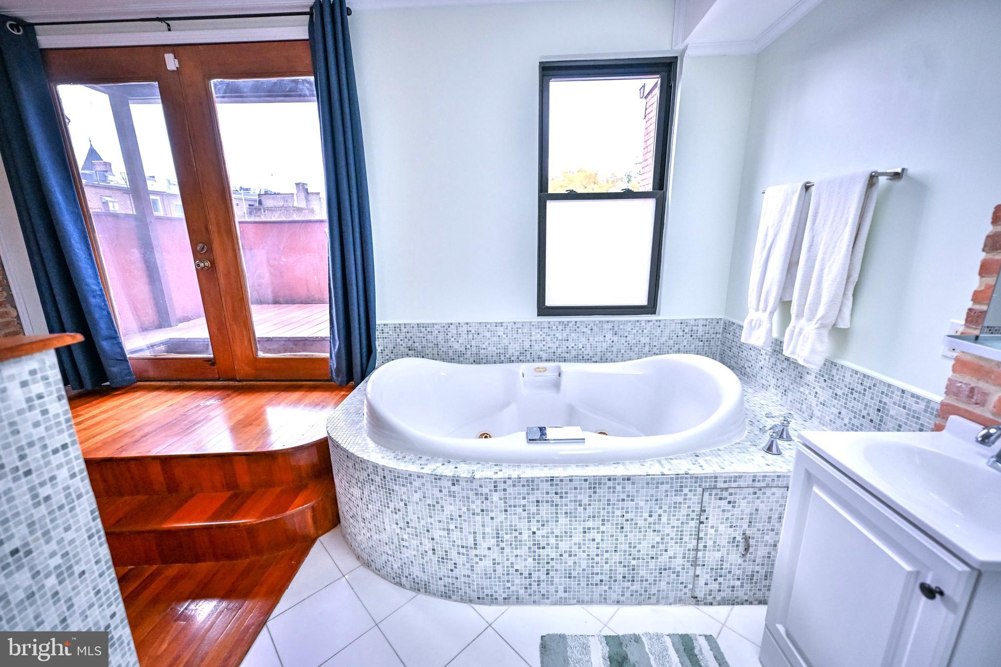 240 Wilson Street Baltimore, MD 21217 - Photo 50 of 63 a bath tub sitting next to a window