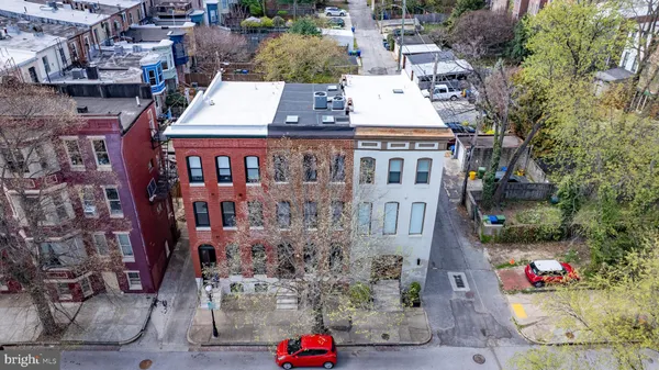 an aerial view of residential houses with outdoor space