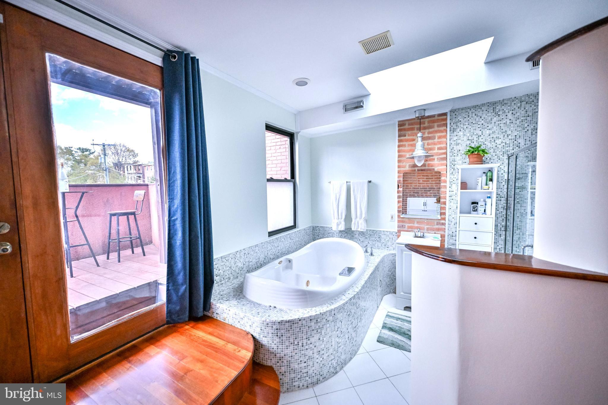 240 Wilson Street Baltimore, MD 21217 - Photo 51 of 63 a living room with furniture and a window