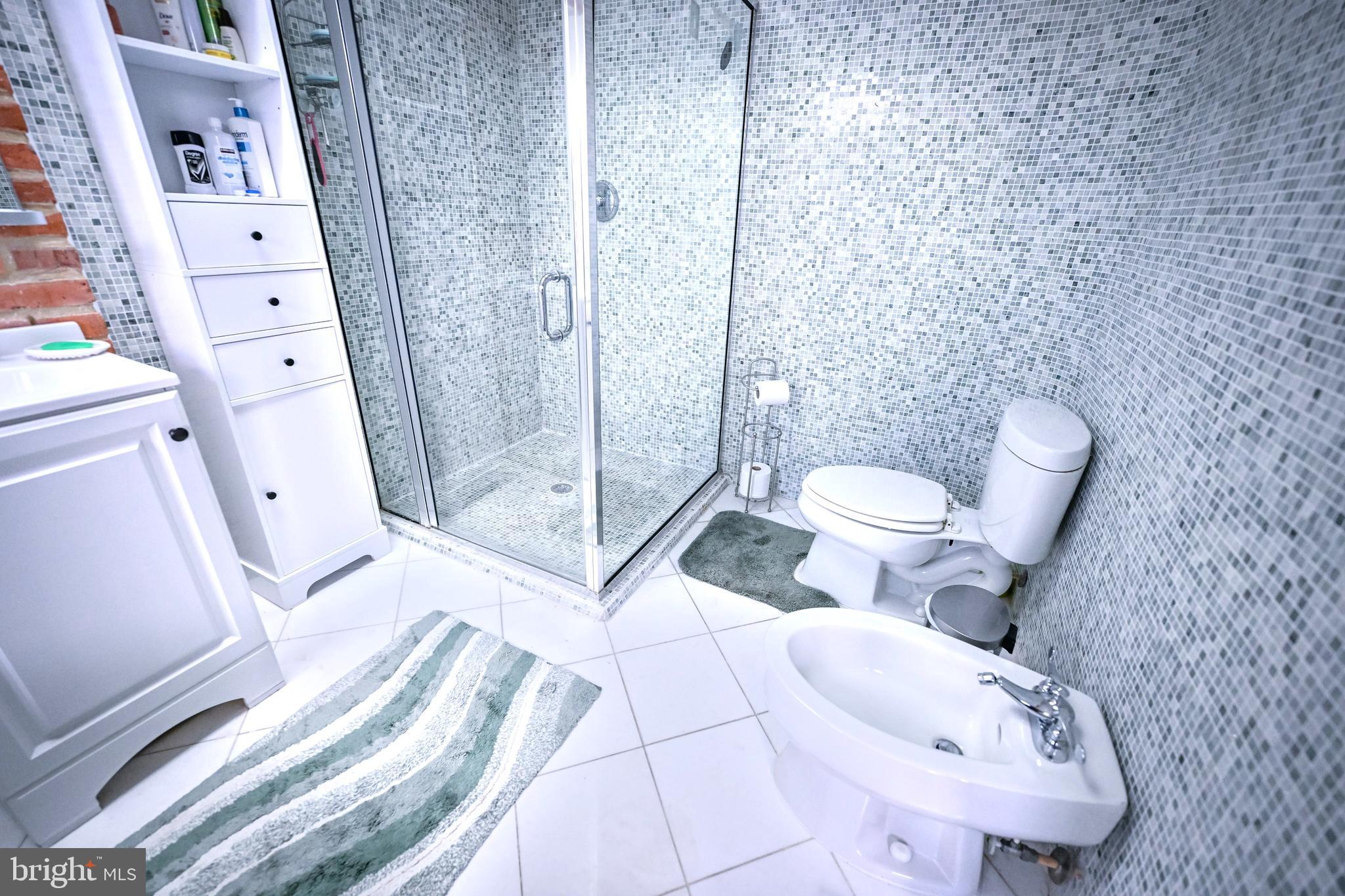 240 Wilson Street Baltimore, MD 21217 - Photo 53 of 63 a bathroom with a sink and toilet