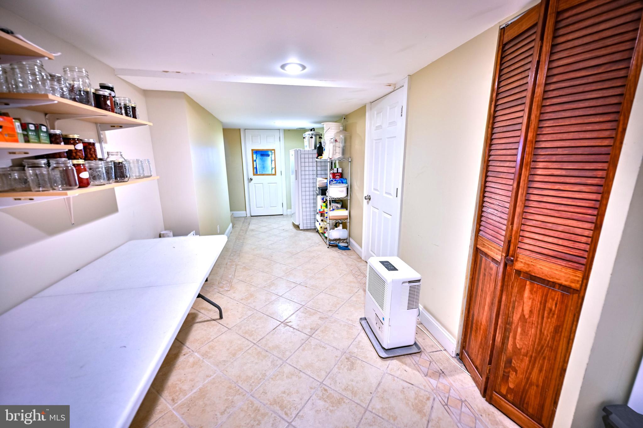 240 Wilson Street Baltimore, MD 21217 - Photo 57 of 63 a bedroom with furniture and a rug