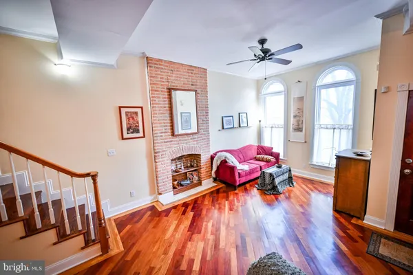 a dining room with furniture and wooden floor
