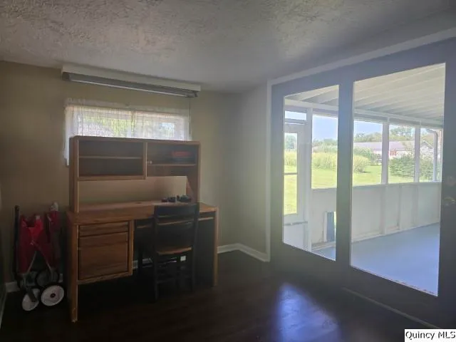 a view of a room with window and furniture