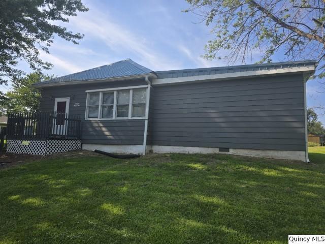 1541 Elm Street Hamilton, IL 62341 - Photo 26 of 31 a view of backyard with a garden and deck