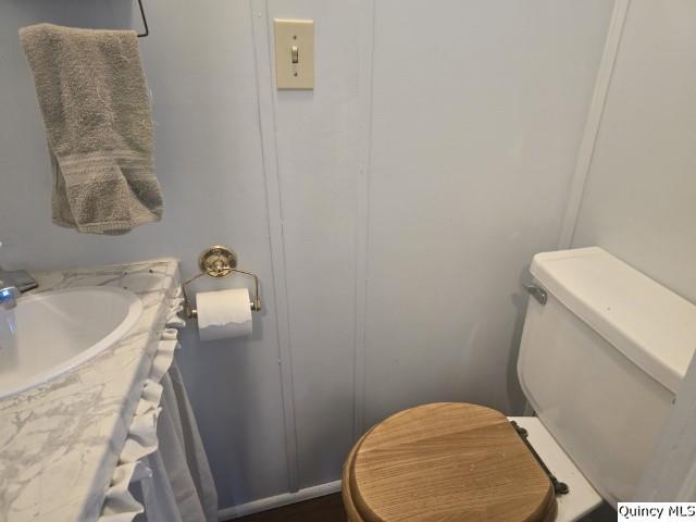 1541 Elm Street Hamilton, IL 62341 - Photo 4 of 31 a white toilet sitting next to a bath tub