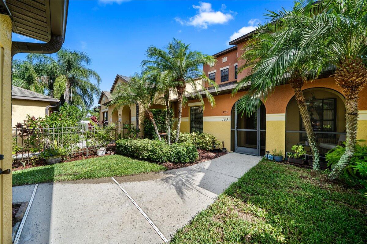 750 Luminary Circle, Unit 103 Melbourne, FL 32901 - Photo 1 of 39 a front view of a house with garden