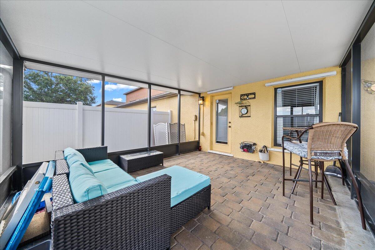 750 Luminary Circle, Unit 103 Melbourne, FL 32901 - Photo 21 of 39 a living room with furniture and a large window