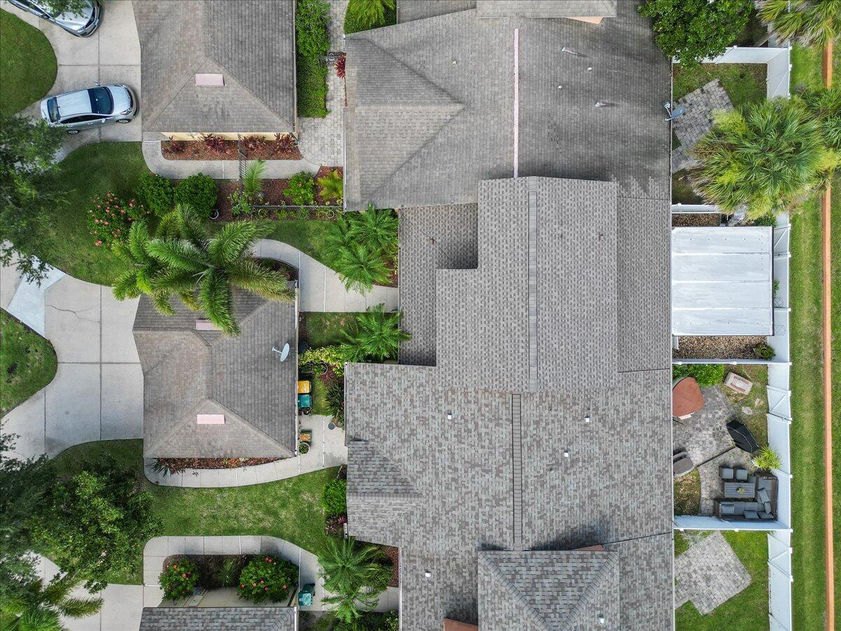 750 Luminary Circle, Unit 103 Melbourne, FL 32901 - Photo 25 of 39 an aerial view of a house with a yard and potted plants