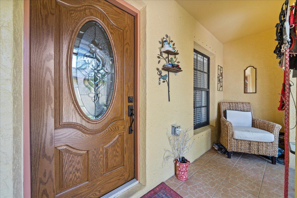 750 Luminary Circle, Unit 103 Melbourne, FL 32901 - Photo 3 of 39 a view of a livingroom with furniture and a chandelier