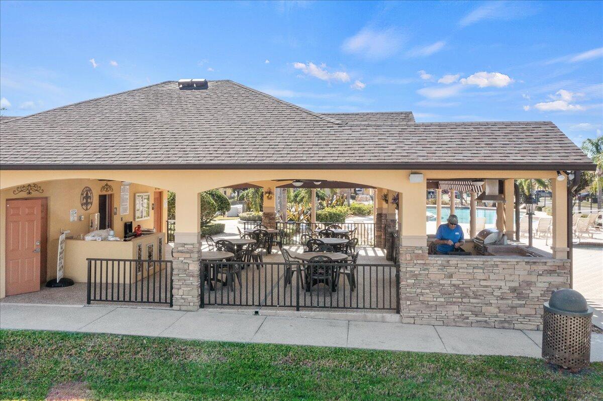 750 Luminary Circle, Unit 103 Melbourne, FL 32901 - Photo 33 of 39 a view of a house with backyard and porch