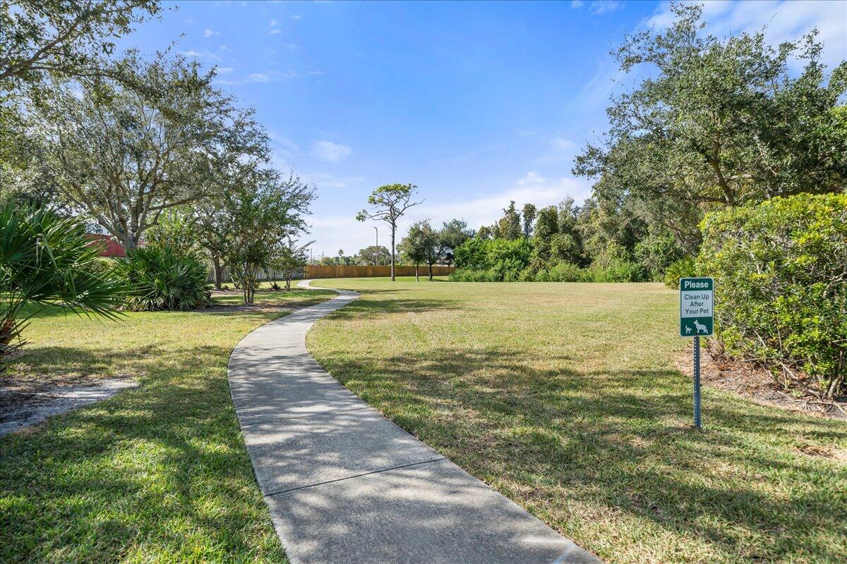 750 Luminary Circle, Unit 103 Melbourne, FL 32901 - Photo 38 of 39 a view of a lake with houses in the background