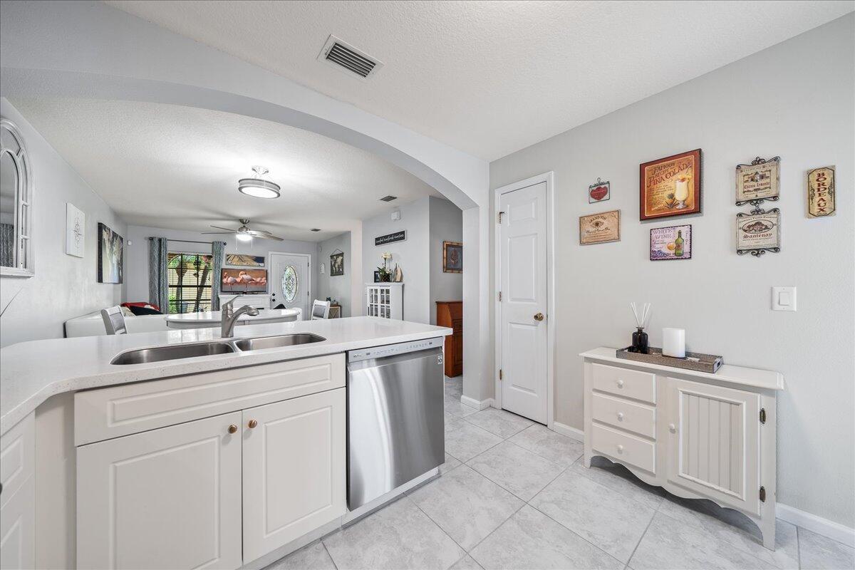 750 Luminary Circle, Unit 103 Melbourne, FL 32901 - Photo 9 of 39 a kitchen with a sink and cabinets