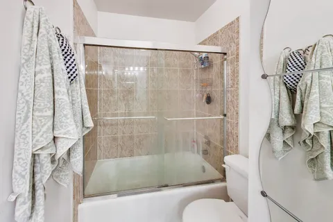 a bathroom with a shower and bathtub