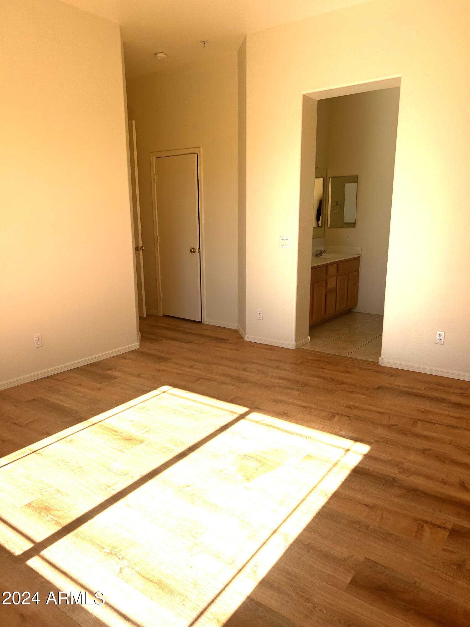 1225 North 36th Street, Unit 2115 Phoenix, AZ 85008 - Photo 23 of 36 a view of a big room with wooden floor