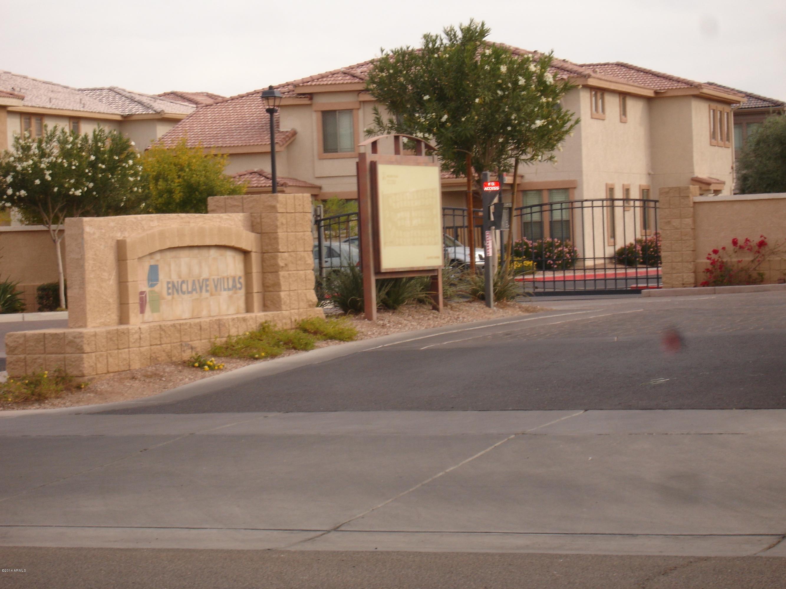 1225 North 36th Street, Unit 2115 Phoenix, AZ 85008 - Photo 36 of 36 a backyard of a house with large trees and outdoor seating