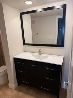 a bathroom with a sink and a mirror