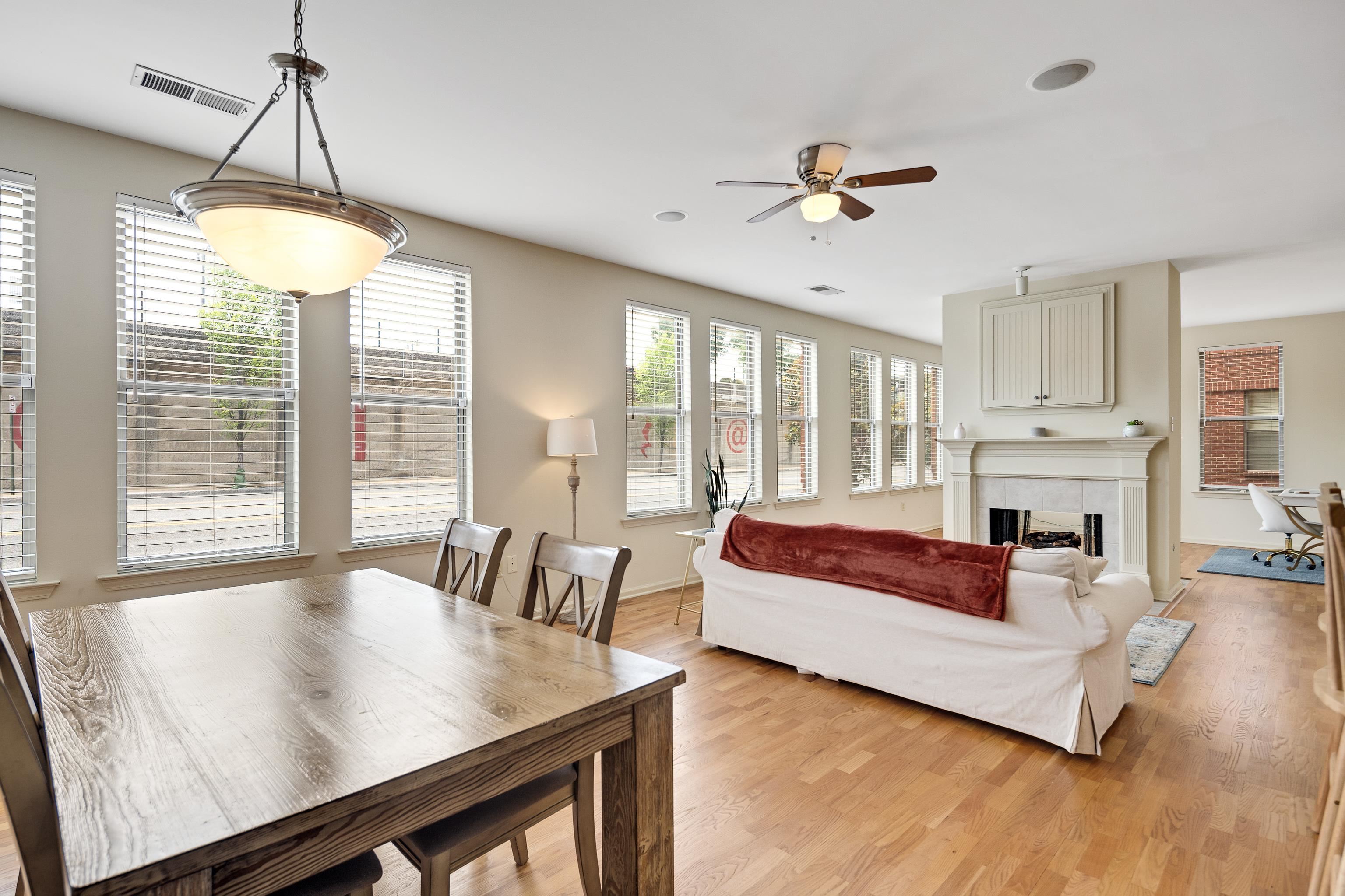 600 South Main Street, Unit 101 Memphis, TN 38103 - Photo 8 of 35 a living room with furniture and a chandelier