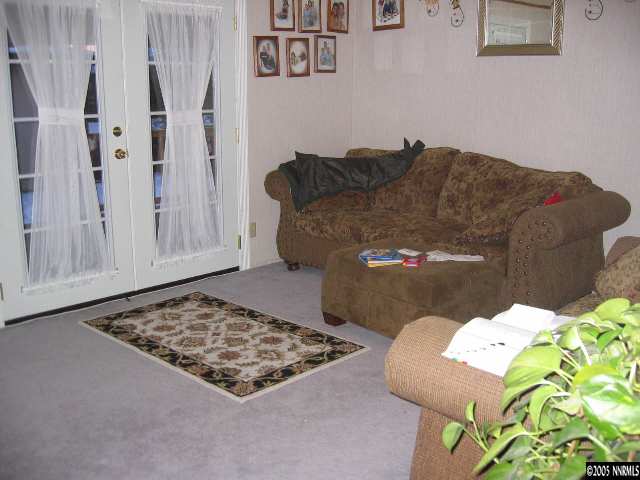 17810 Fantail Circle Reno, NV 89508 - Photo 2 of 9 a living room with furniture and a rug