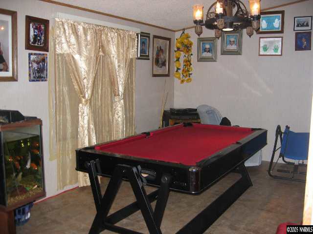 17810 Fantail Circle Reno, NV 89508 - Photo 3 of 9 a bedroom with a bed and a table