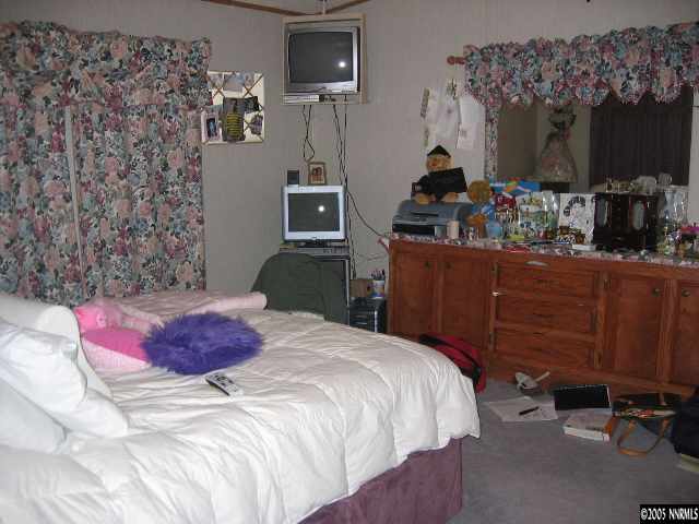 17810 Fantail Circle Reno, NV 89508 - Photo 6 of 9 a bedroom with bed and wooden floor