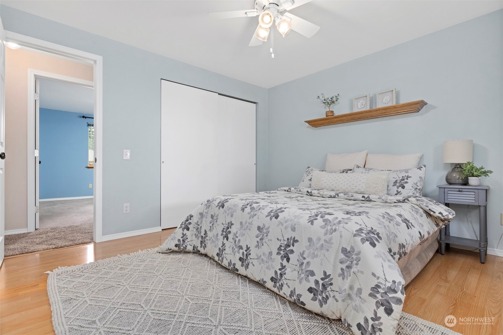 804 Chestnut Street Everson, WA 98247 - Photo 12 of 22 a bedroom with a large bed and a chandelier