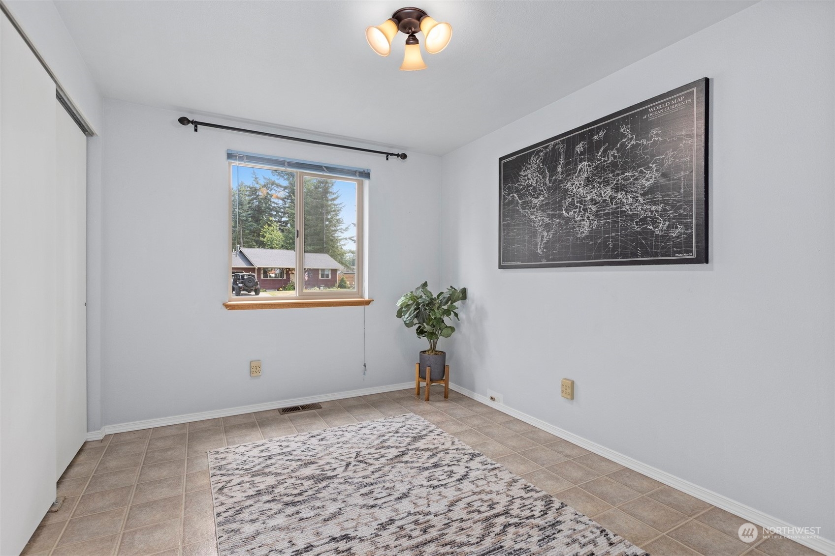 804 Chestnut Street Everson, WA 98247 - Photo 14 of 22 a view of a bedroom with wooden floor and a window
