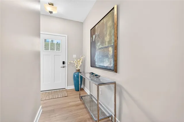 a view of a hallway with windows