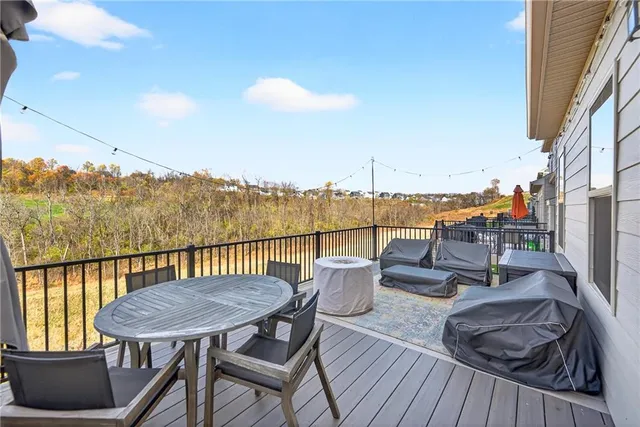 a view of a balcony with table and chairs